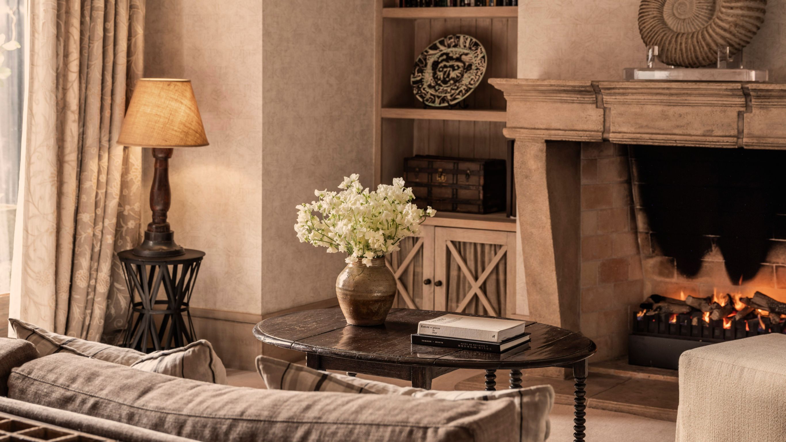 Cozy view of library with fireplace